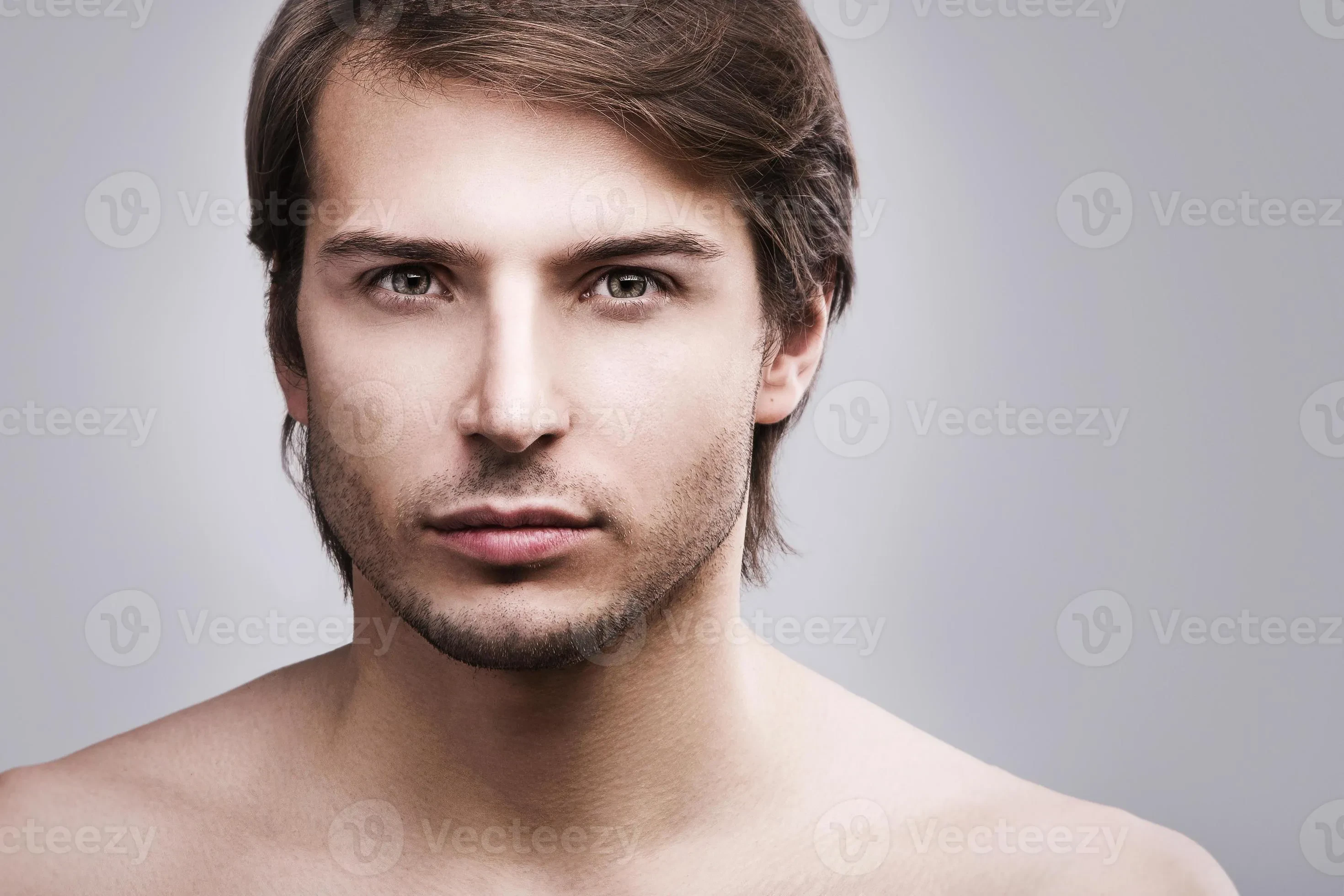 closeup of man with thin beard and subtle eyeshadow